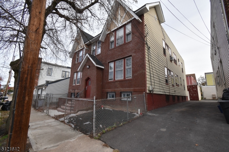 352 Wainwright Street, Unit 1L Newark, NJ 07112 - Photo 11 of 11 a view of a building with a tree