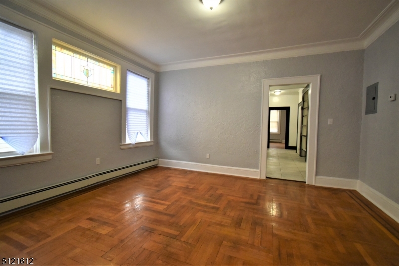 352 Wainwright Street, Unit 1L Newark, NJ 07112 - Photo 2 of 11 a view of an empty room and window