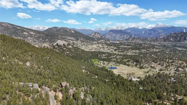 a view of a mountain in the distance in a field