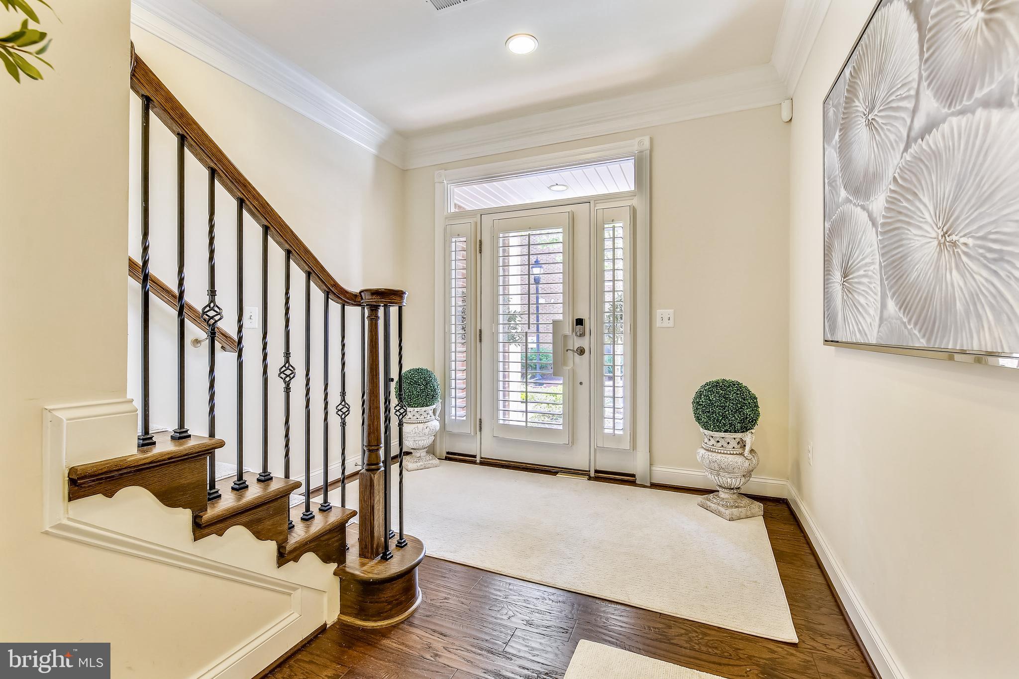 1411 Ridgeview Way Washington, DC 20007 - Photo 3 of 43 a view of an entryway with wooden floor and door