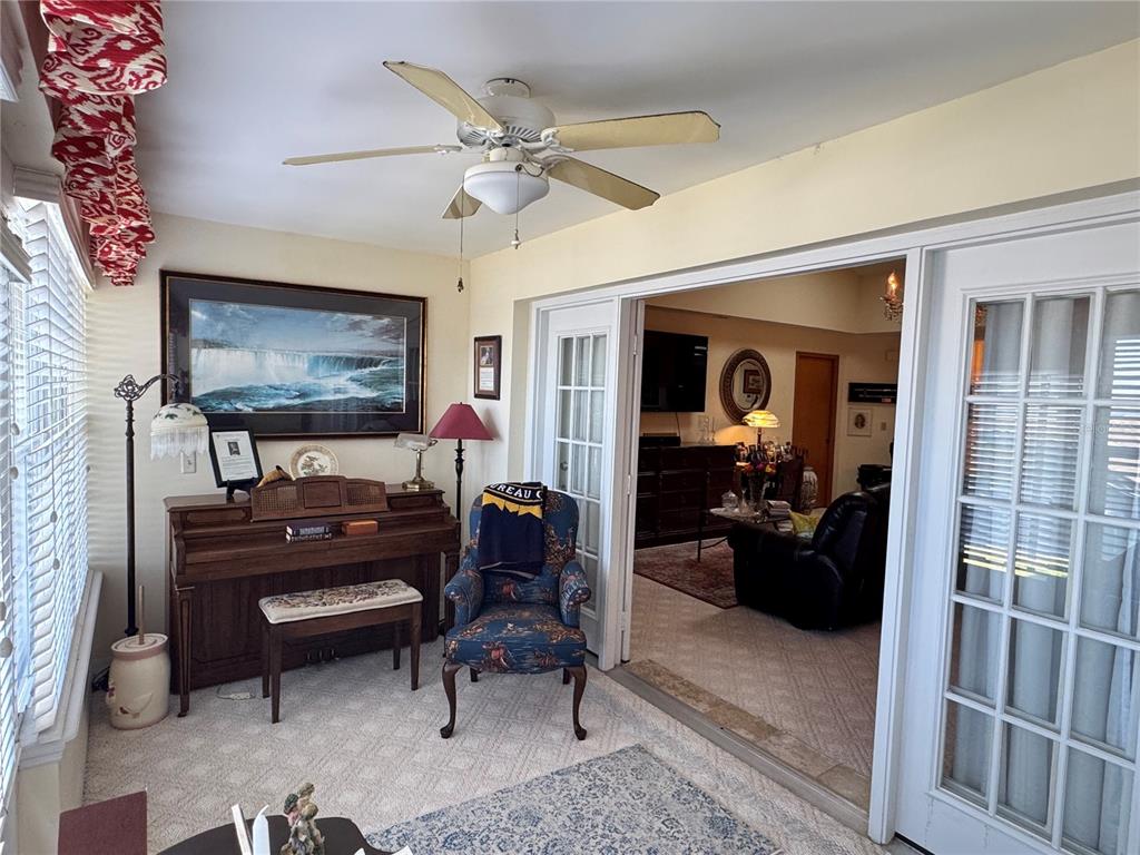 240 Division Street Clermont, FL 34711 - Photo 11 of 16 a living room with furniture and a flat screen tv