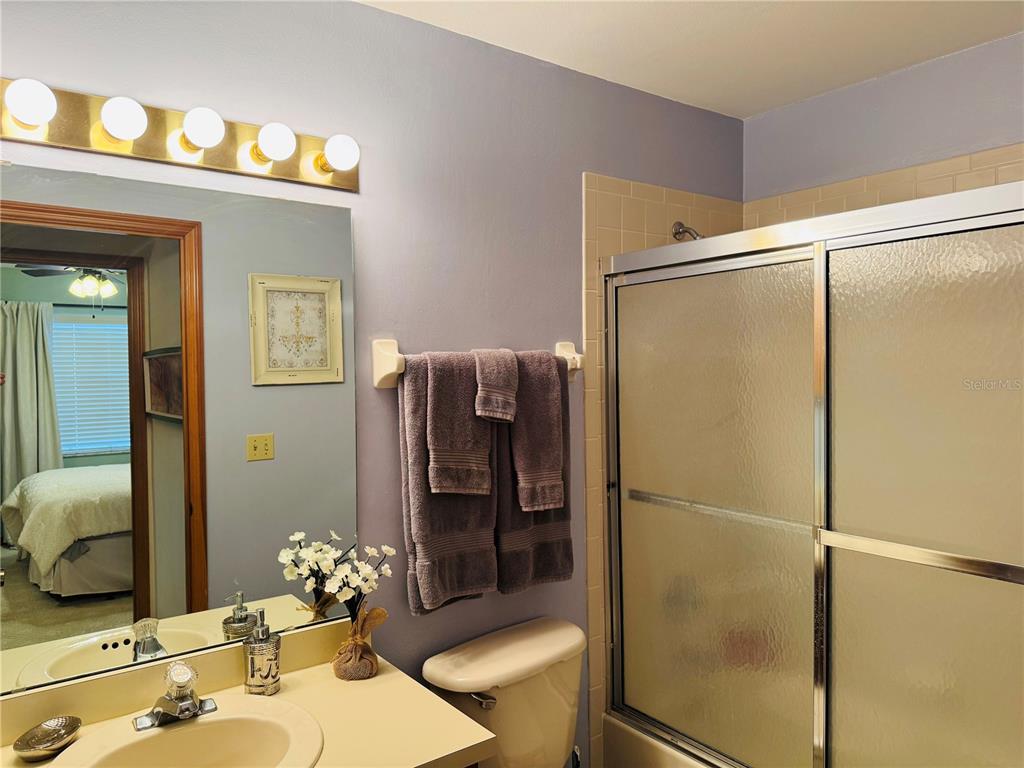 240 Division Street Clermont, FL 34711 - Photo 16 of 16 a bathroom with a shower and a sink