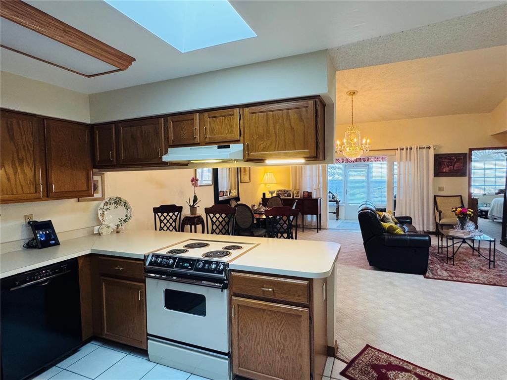 240 Division Street Clermont, FL 34711 - Photo 9 of 16 a kitchen with a stove and a refrigerator