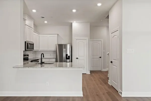 a large bathroom with a sink a mirror and a shower