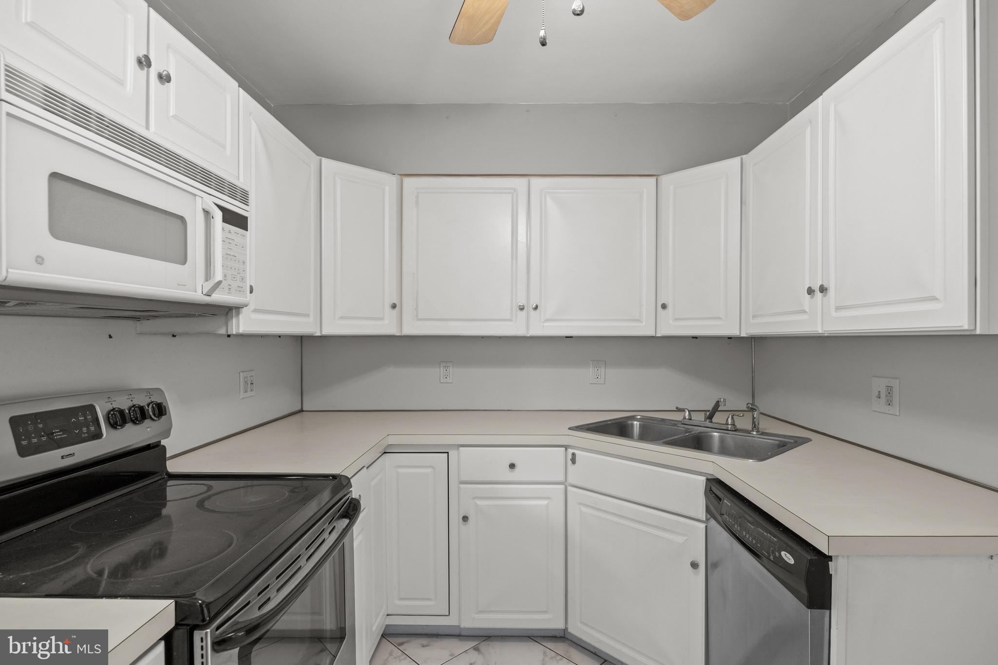 303 Cornell Road Glassboro, NJ 08028 - Photo 15 of 27 a kitchen with granite countertop white cabinets and white appliances