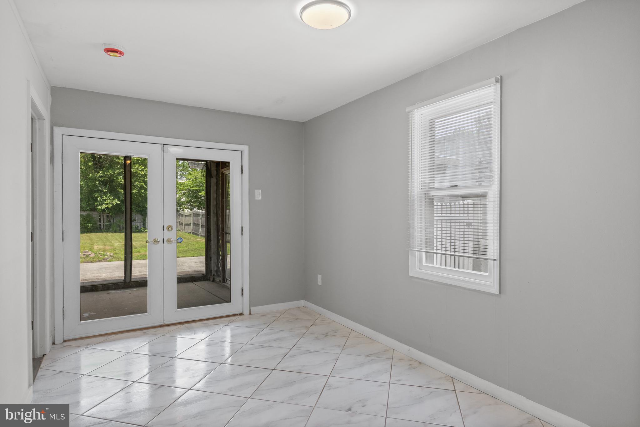 303 Cornell Road Glassboro, NJ 08028 - Photo 18 of 27 an empty room with windows