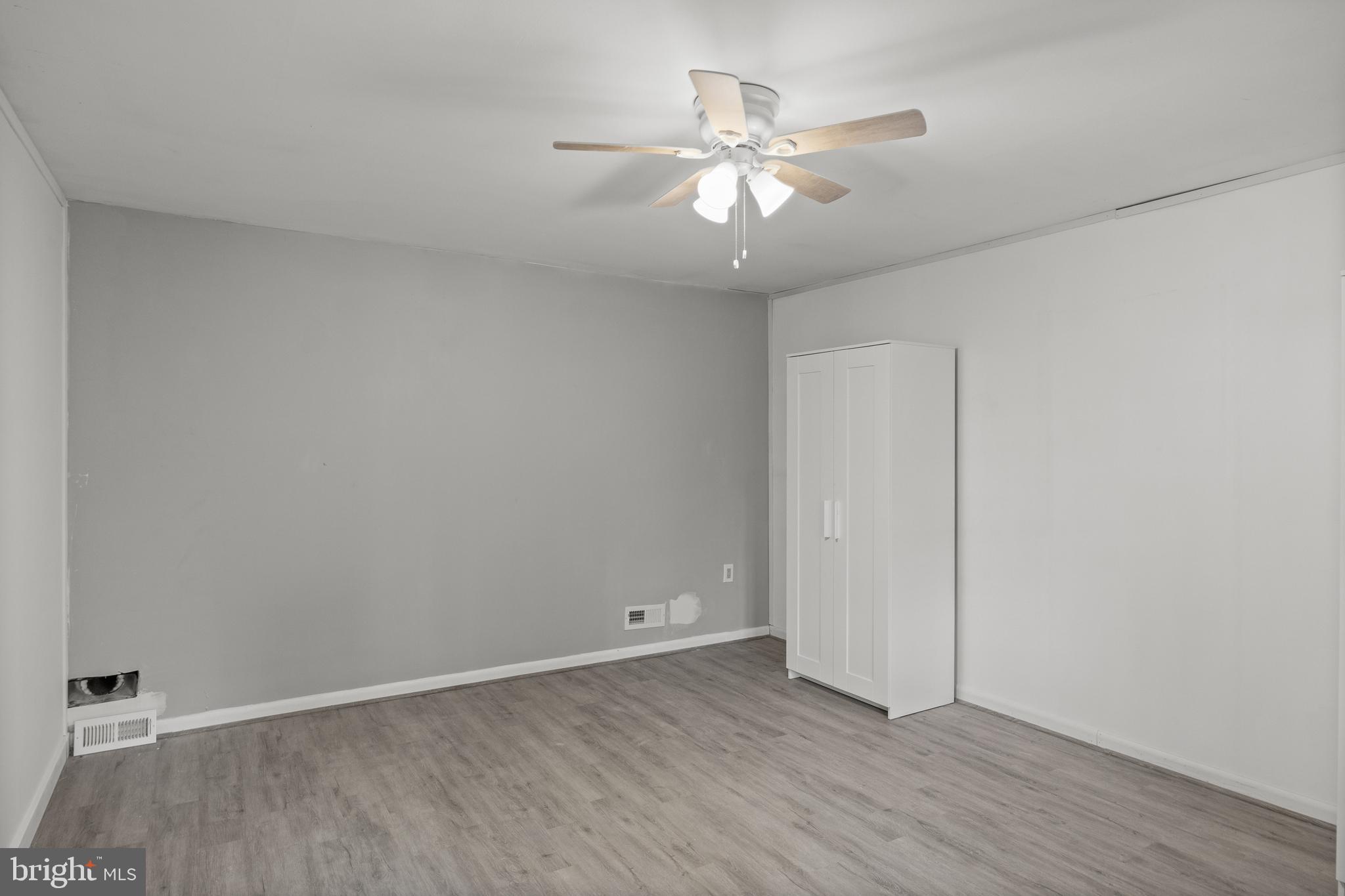 303 Cornell Road Glassboro, NJ 08028 - Photo 19 of 27 a view of an empty room with wooden floor