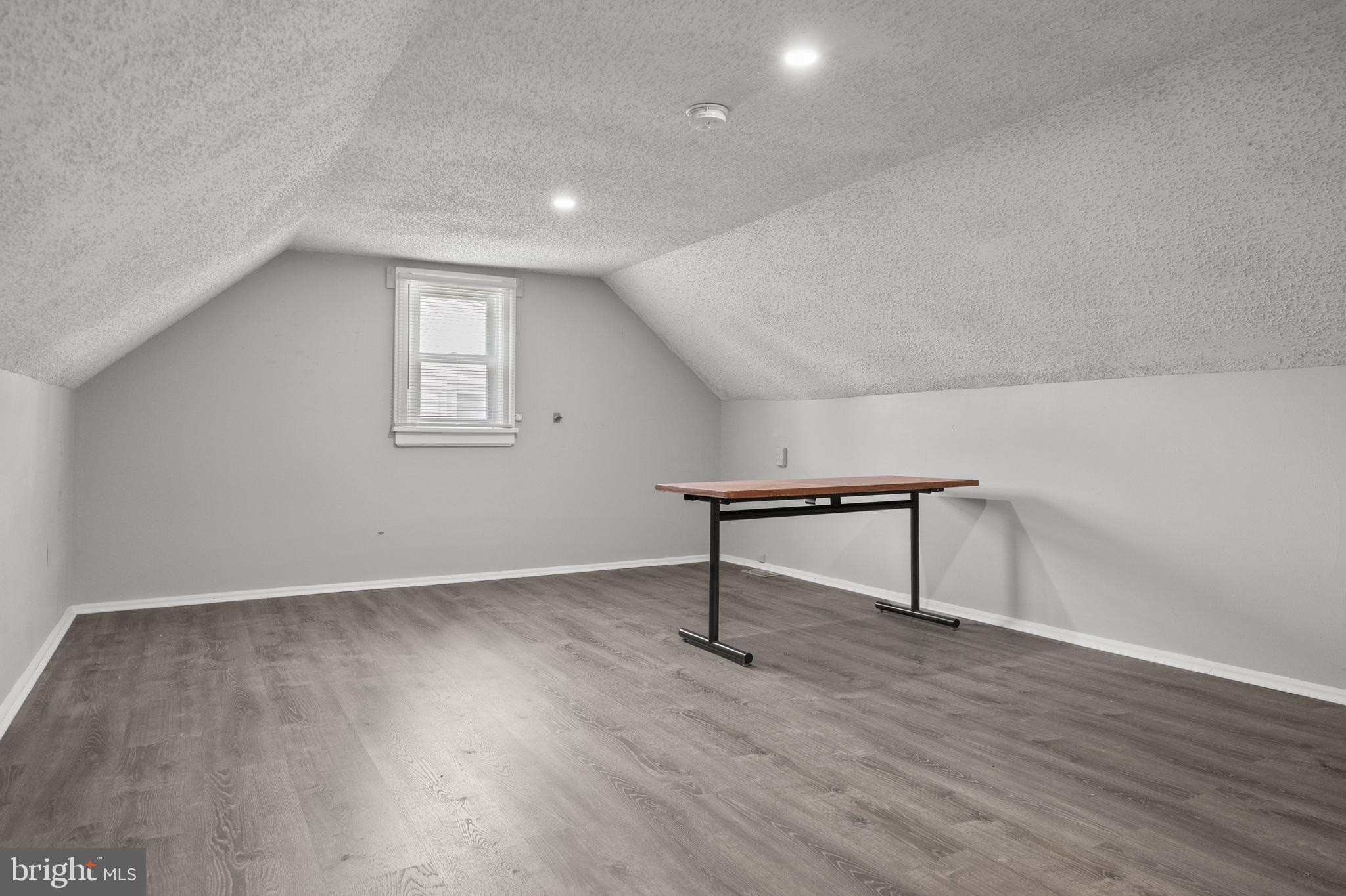 303 Cornell Road Glassboro, NJ 08028 - Photo 22 of 27 a view of an empty room with wooden floor