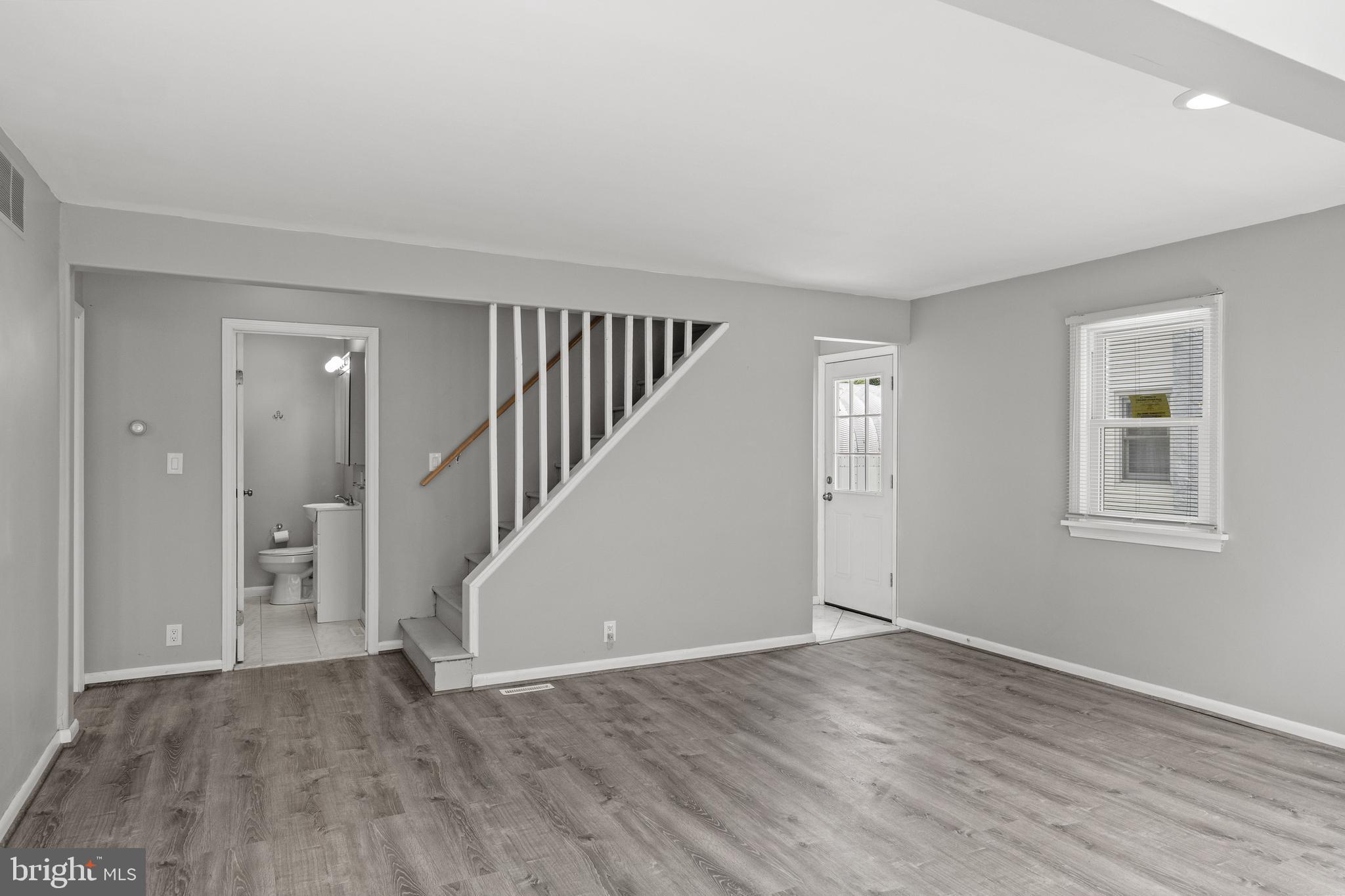 303 Cornell Road Glassboro, NJ 08028 - Photo 7 of 27 wooden floor in an empty room with a window