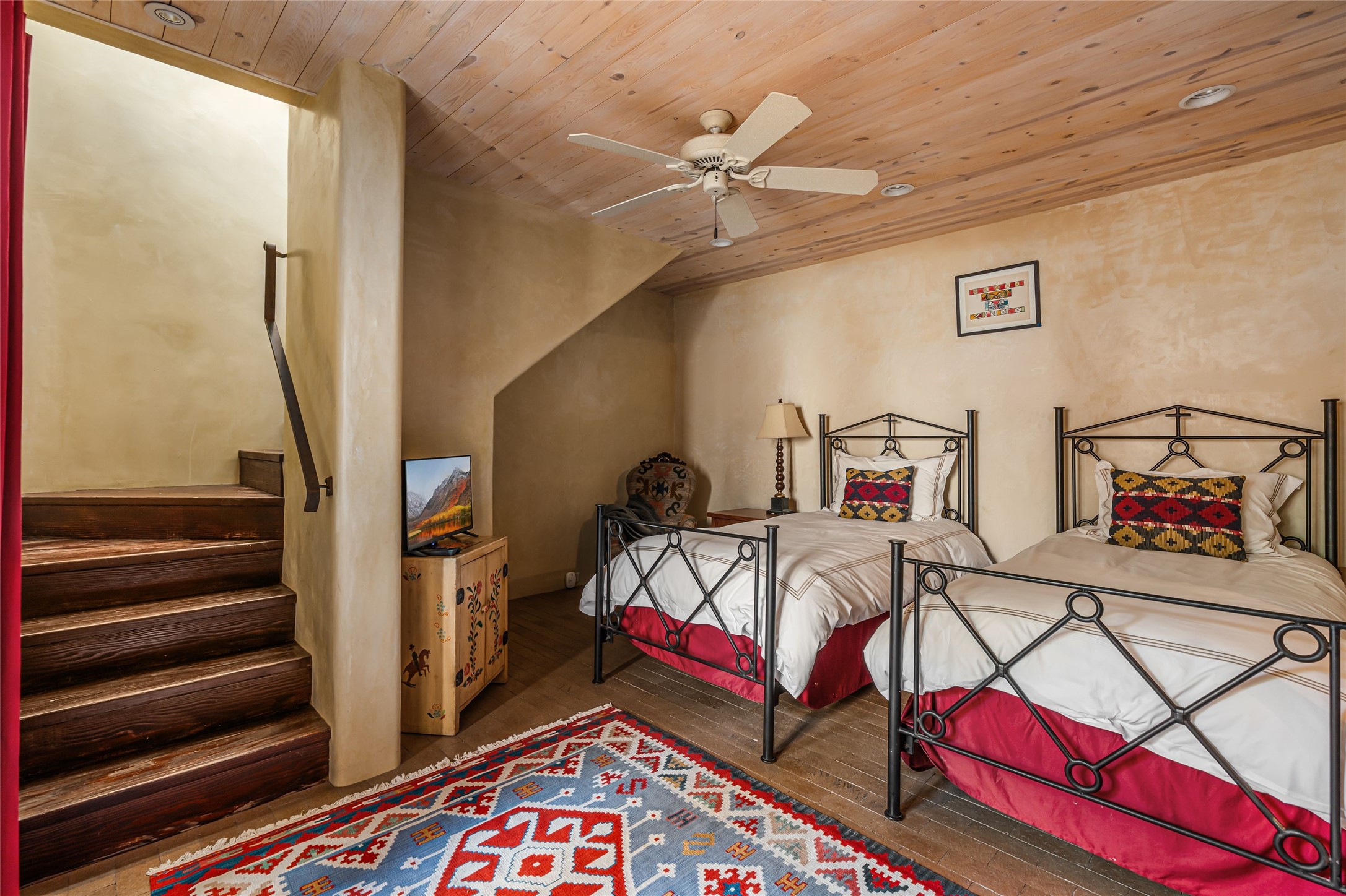 1 Cerro Gordo Road, Unit B Santa Fe, NM 87501 - Photo 19 of 25 Guest bedroom on lower level with outdoor access.
