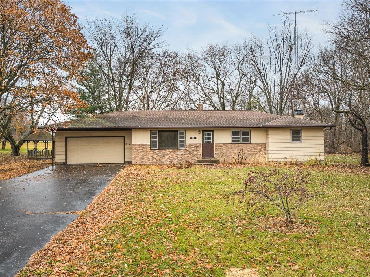 7774 Old River Road Rockford, IL 61103 - Photo 12 of 53 a front view of a house with yard