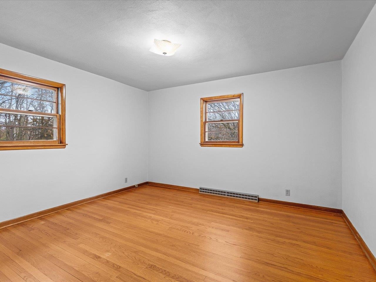 7774 Old River Road Rockford, IL 61103 - Photo 28 of 53 a view of empty room with wooden floor