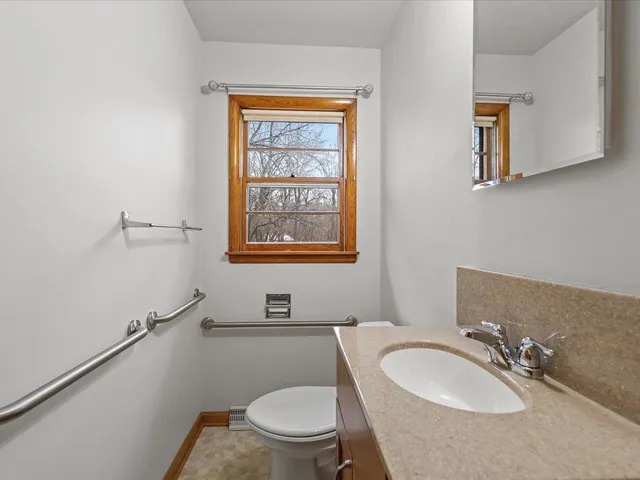 a living room with furniture and large windows