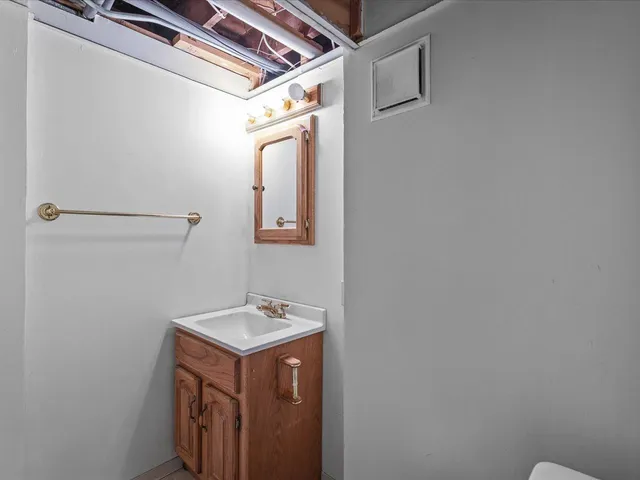 a house that has a tree in front of it