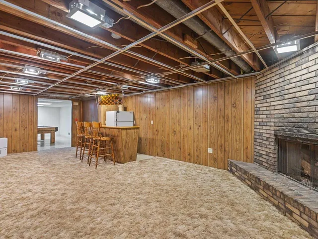 a view of a room with wooden furniture
