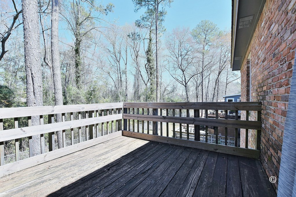 6321 Milgen Road, Unit 4 Columbus, GA 31907 - Photo 16 of 16 Balcony/Deck overlooking the trees
