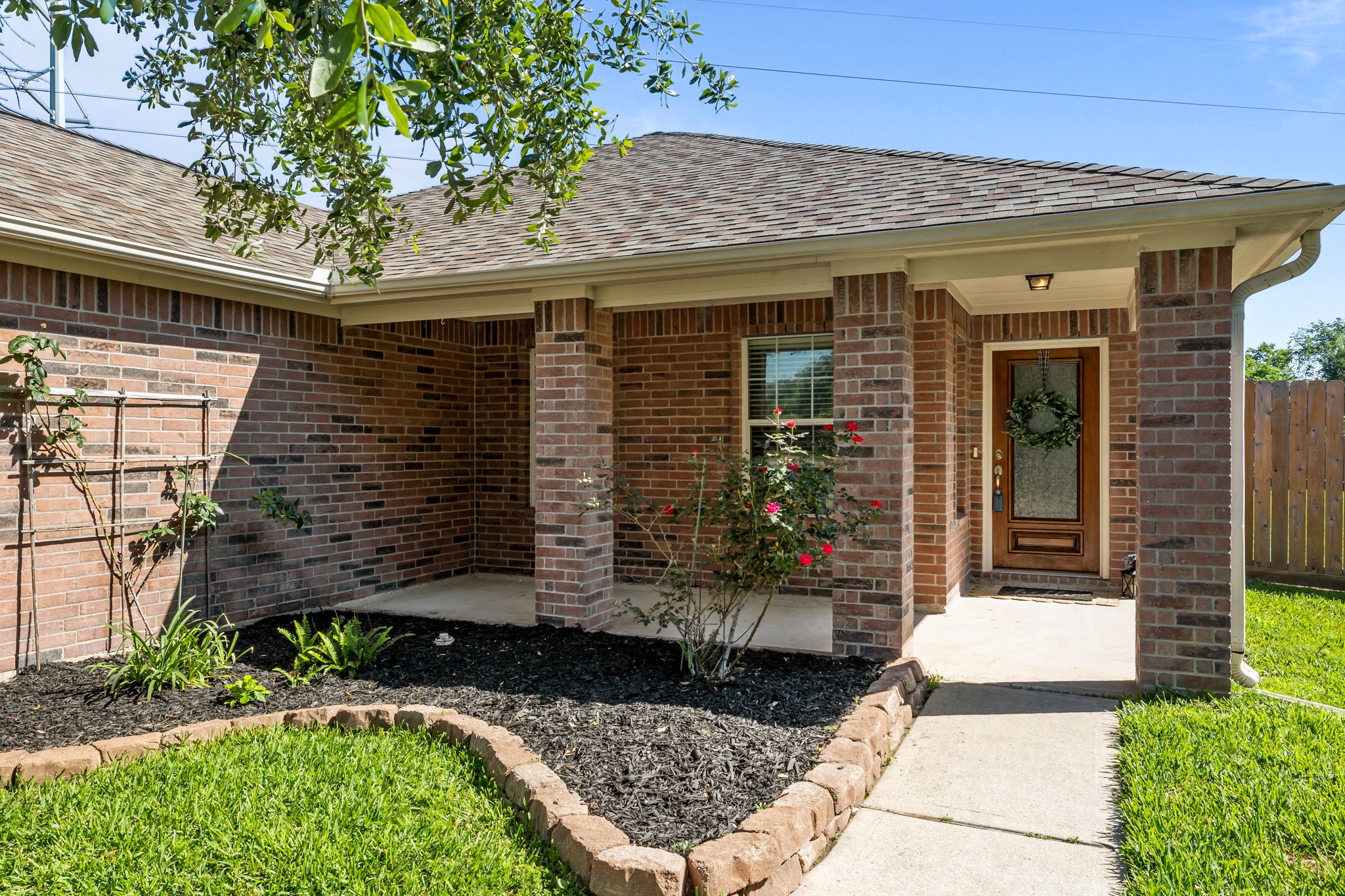 445 Decoster Boulevard Alvin, TX 77511 - Photo 3 of 32 Lovely front porch for sipping coffee and watching birds