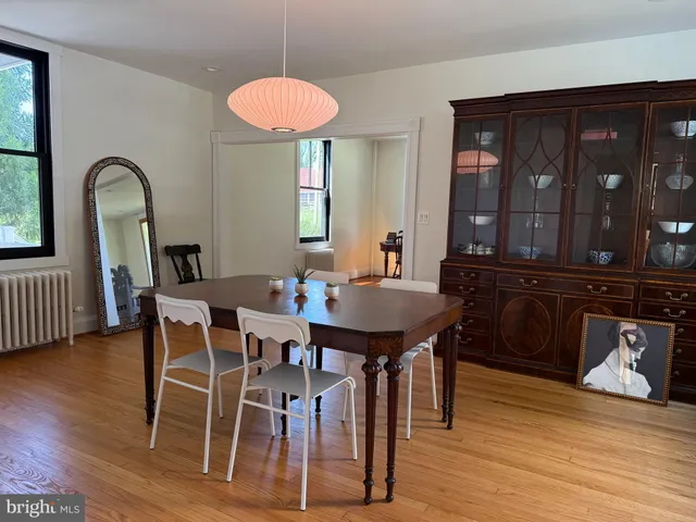 a bedroom with a bed and a mirror