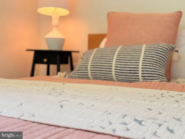 a bedroom with bed and window