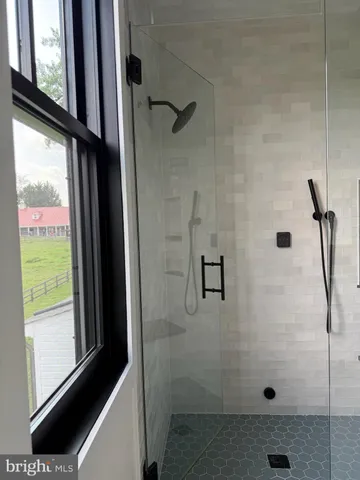 a bathroom with a sink mirror and toilet