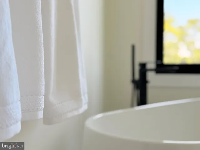 a view of a swimming pool with a bench in the background
