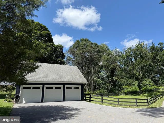 a kitchen with stainless steel appliances granite countertop a sink dishwasher stove and oven with wooden floor