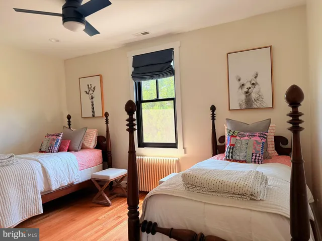 a view of a room with a table and chairs