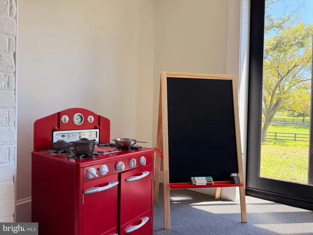 a view of two chairs in patio with a big yard