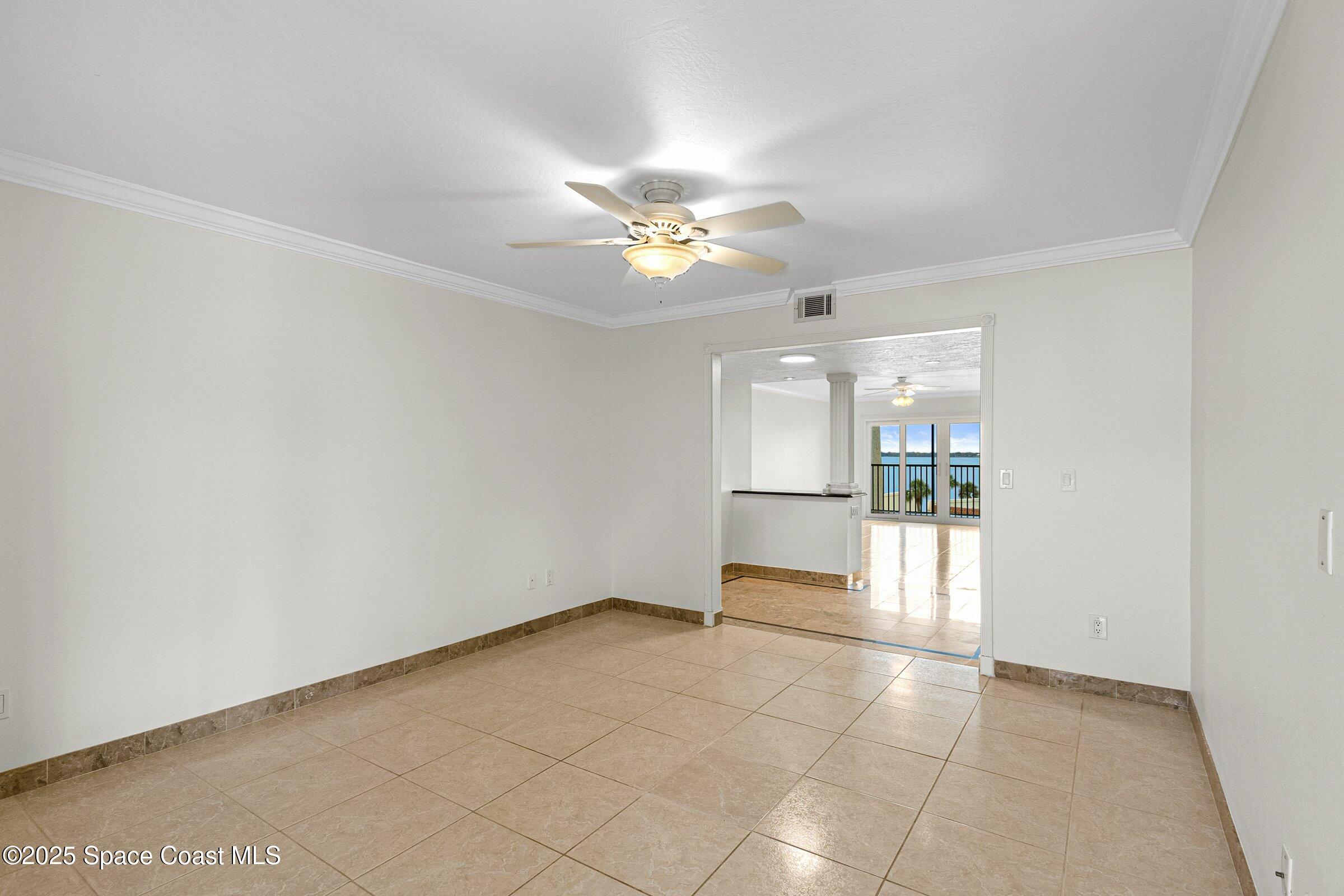 115 Indian River Drive, Unit 327 Cocoa, FL 32922 - Photo 15 of 47 wooden floor in an empty room with a window