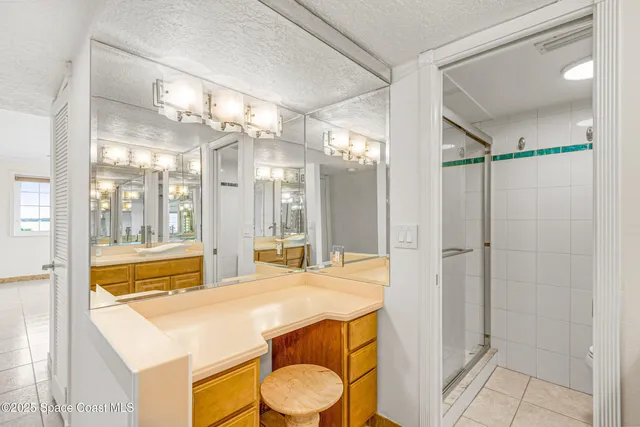 a spacious bathroom with a double vanity sink mirror and