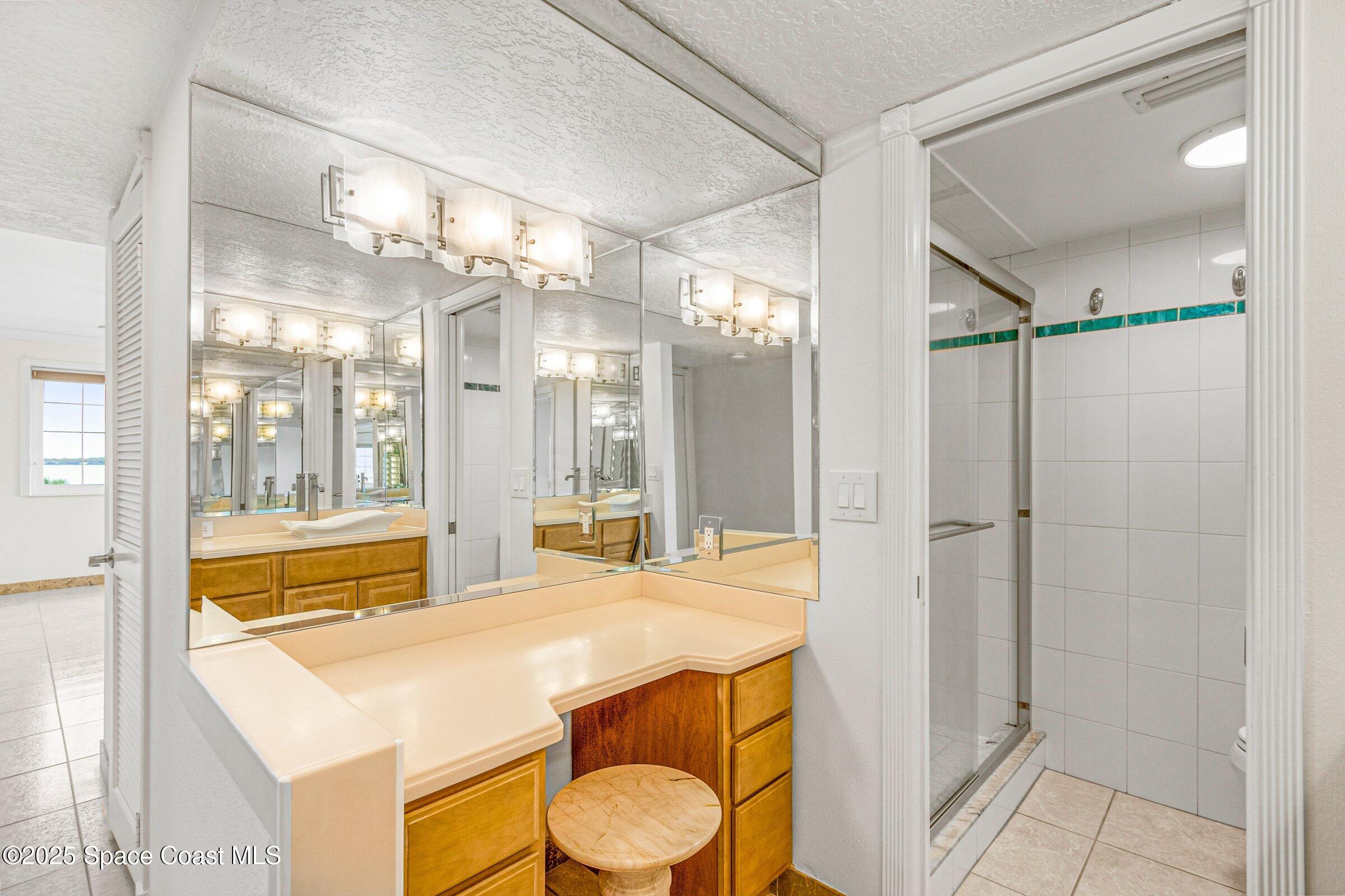 115 Indian River Drive, Unit 327 Cocoa, FL 32922 - Photo 18 of 47 a spacious bathroom with a tub and shower