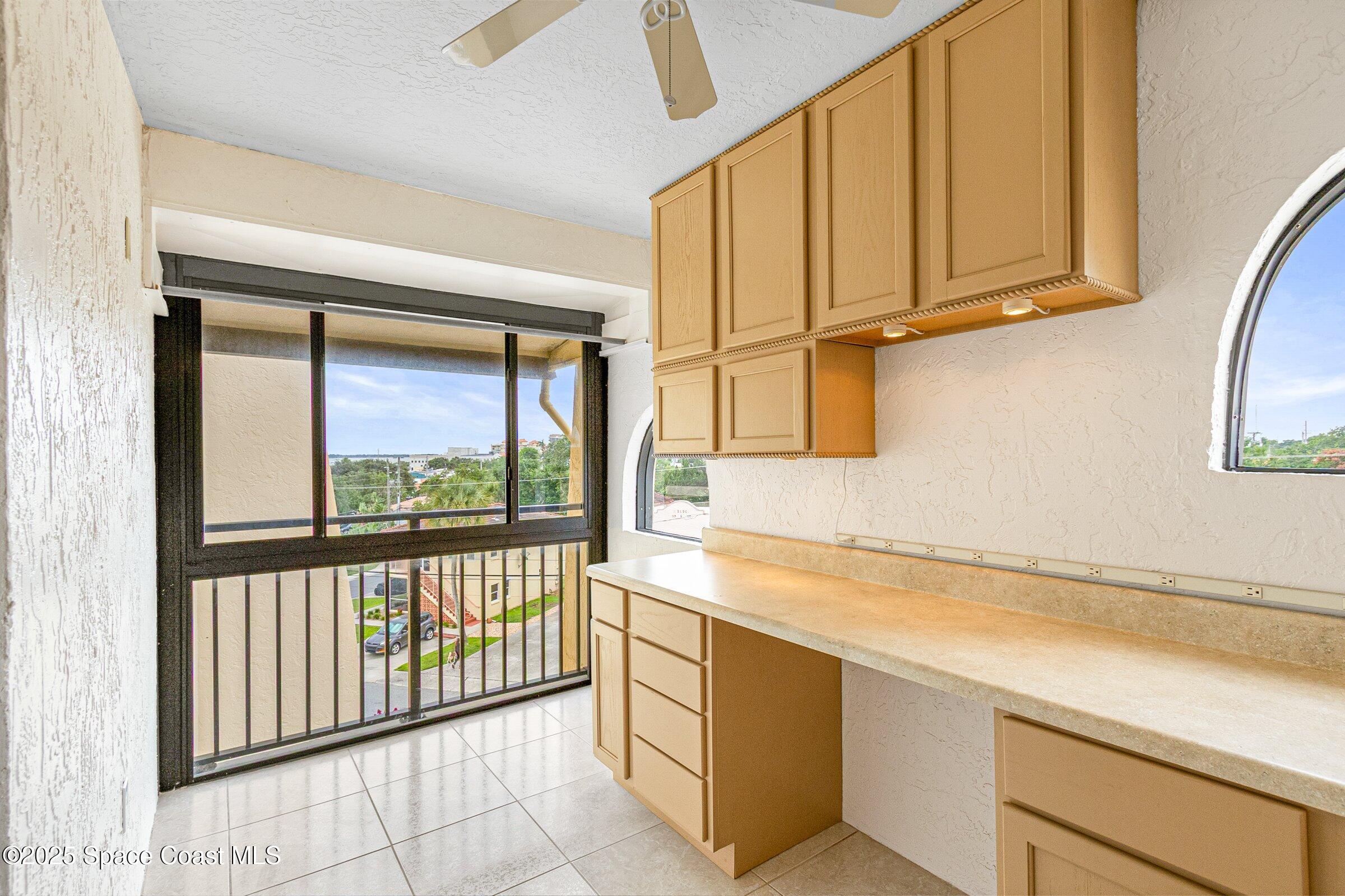 115 Indian River Drive, Unit 327 Cocoa, FL 32922 - Photo 24 of 47 a view of a kitchen with a sink and cabinets