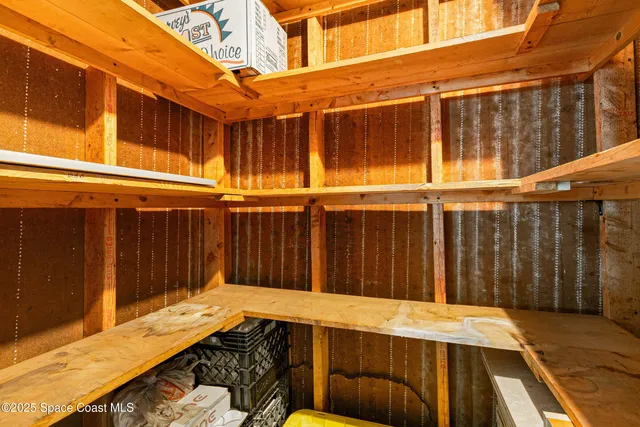 a view of a garage with parked cars