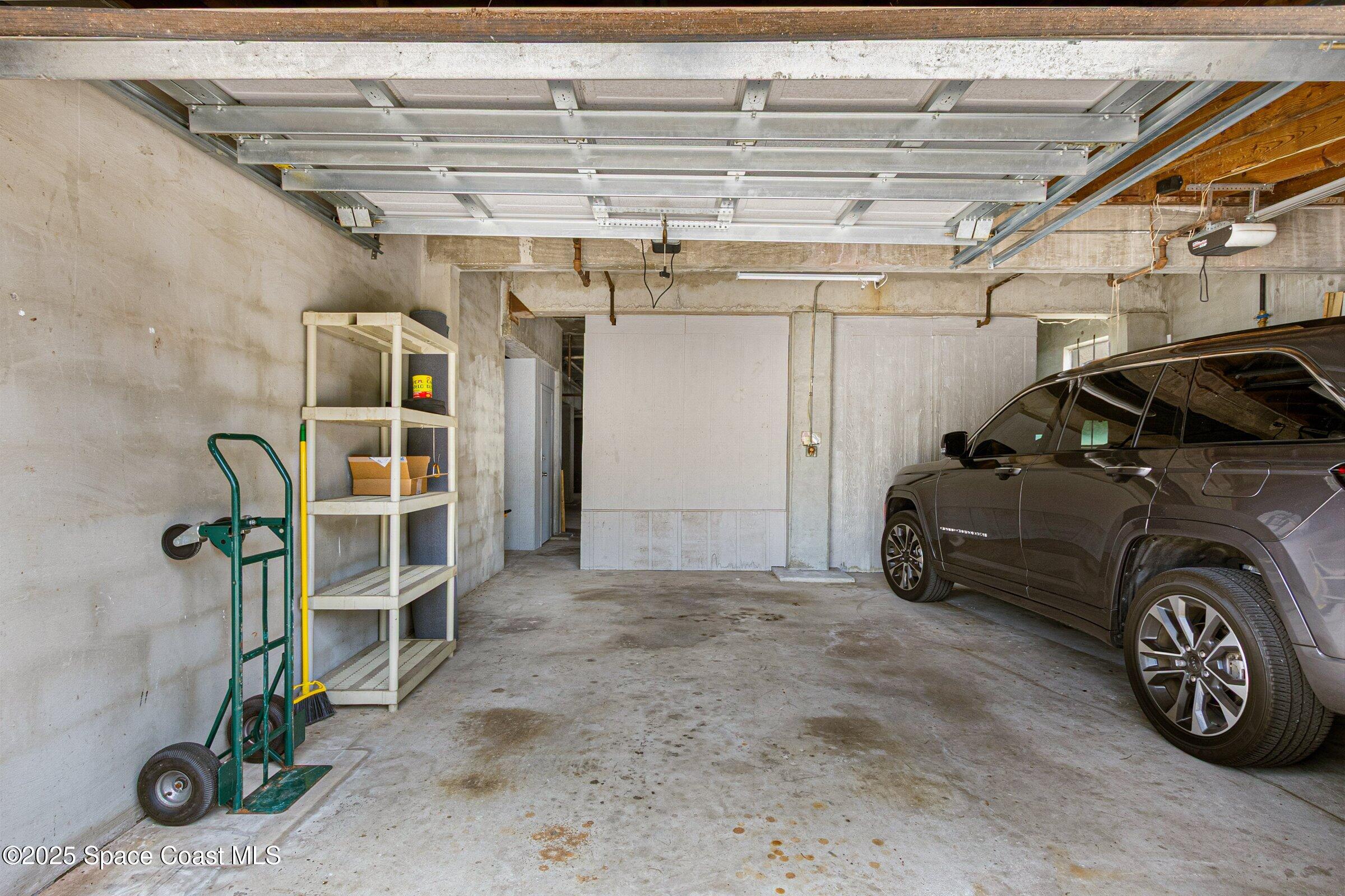 115 Indian River Drive, Unit 327 Cocoa, FL 32922 - Photo 29 of 47 a view of a garage with parked cars