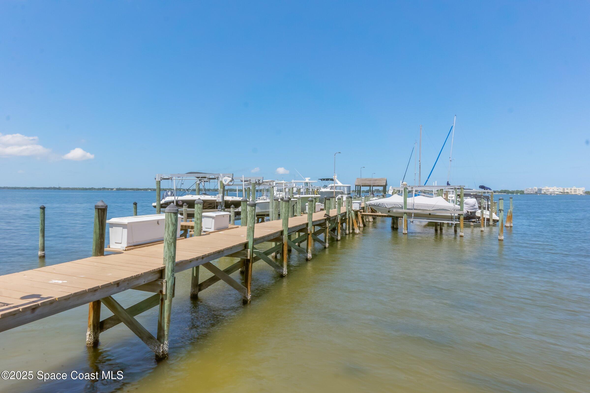115 Indian River Drive, Unit 327 Cocoa, FL 32922 - Photo 32 of 47 a dining room with furniture and wooden floor