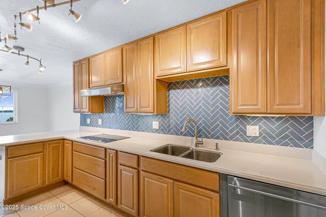 a kitchen with a sink cabinets and window