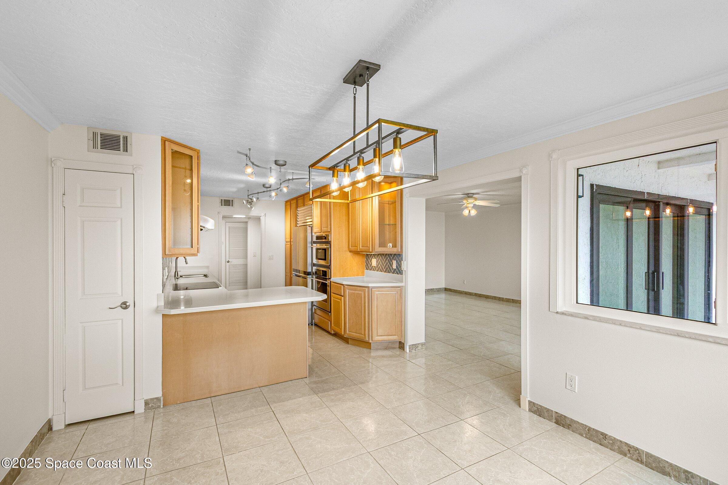 115 Indian River Drive, Unit 327 Cocoa, FL 32922 - Photo 8 of 47 a bathroom with a tub sink and mirror