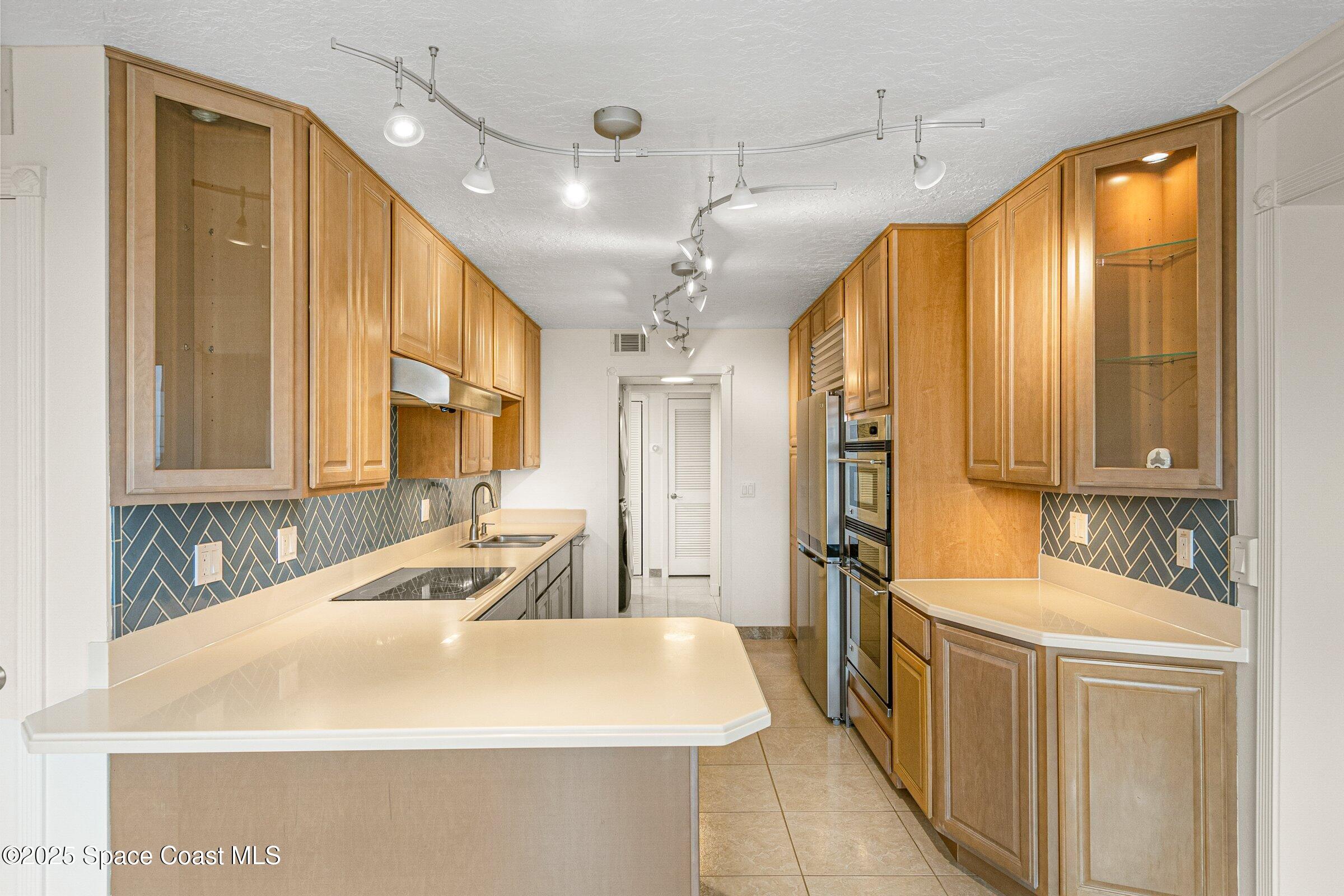 115 Indian River Drive, Unit 327 Cocoa, FL 32922 - Photo 9 of 47 a bathroom with a tub a sink a mirror and a shower