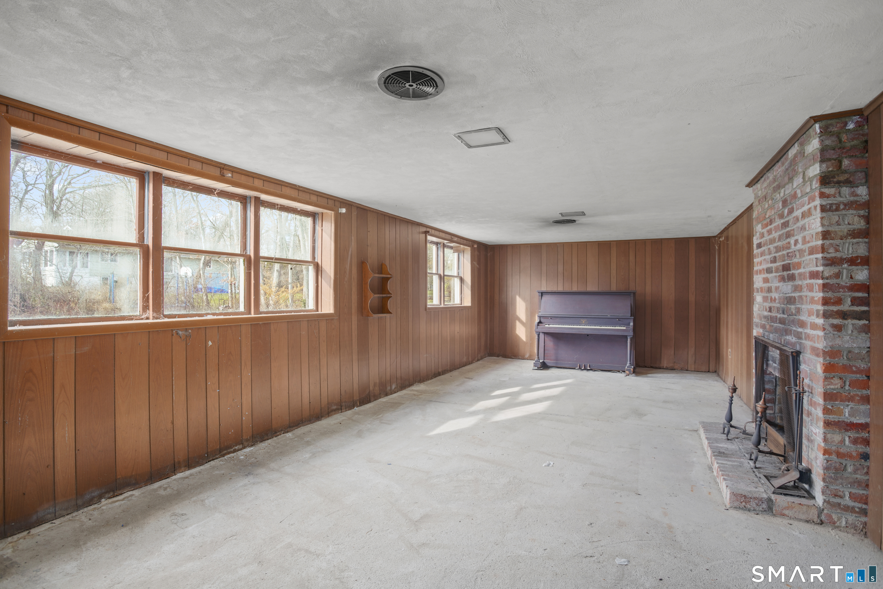 101 Applegate Road Fairfield, CT 06825 - Photo 16 of 19 Walk out Lower Level with Fireplace. Great potential!