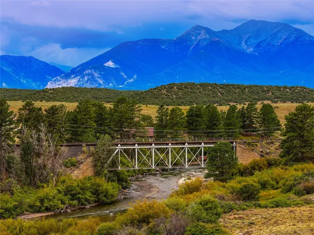 a view of lake from balcony with outdoor seating