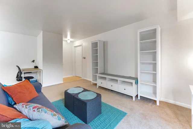 a bedroom with furniture and a chair