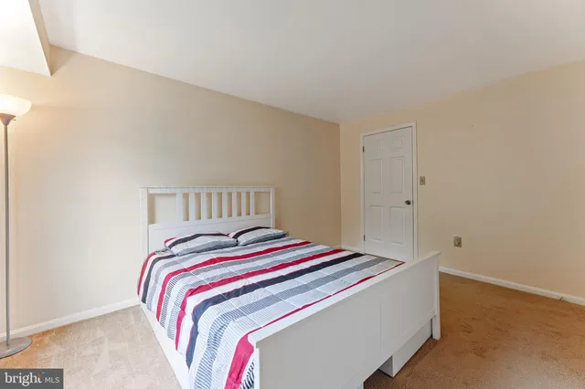 a bedroom with a bed and a closet