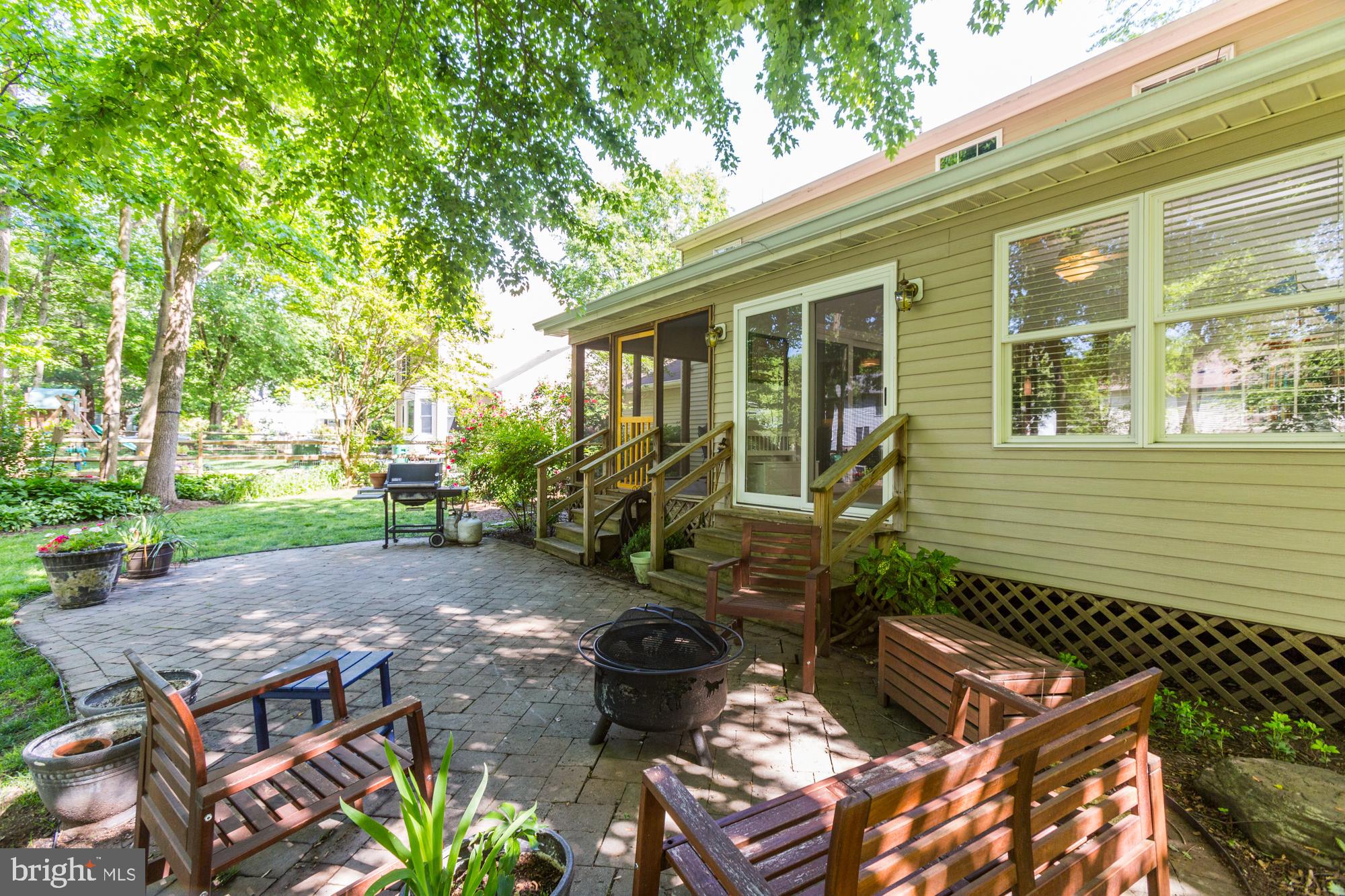 326 Riding Ridge Road Annapolis, MD 21403 - Photo 54 of 63 a view of backyard with outdoor seating and a garden