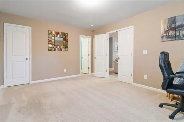 a view of room with workspace and windows