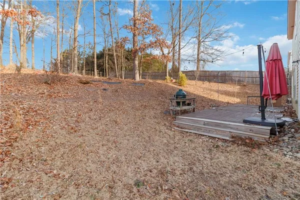 a view of a backyard with a bench