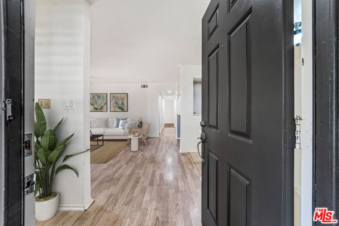 2053 Majorca Drive Oxnard, CA 93035 - Photo 2 of 15 a living room with furniture and a potted plant