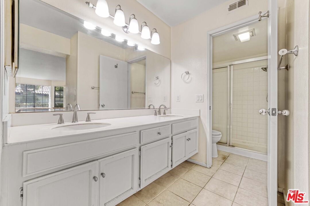 2053 Majorca Drive Oxnard, CA 93035 - Photo 8 of 15 a spacious bathroom with a double vanity sink mirror and double