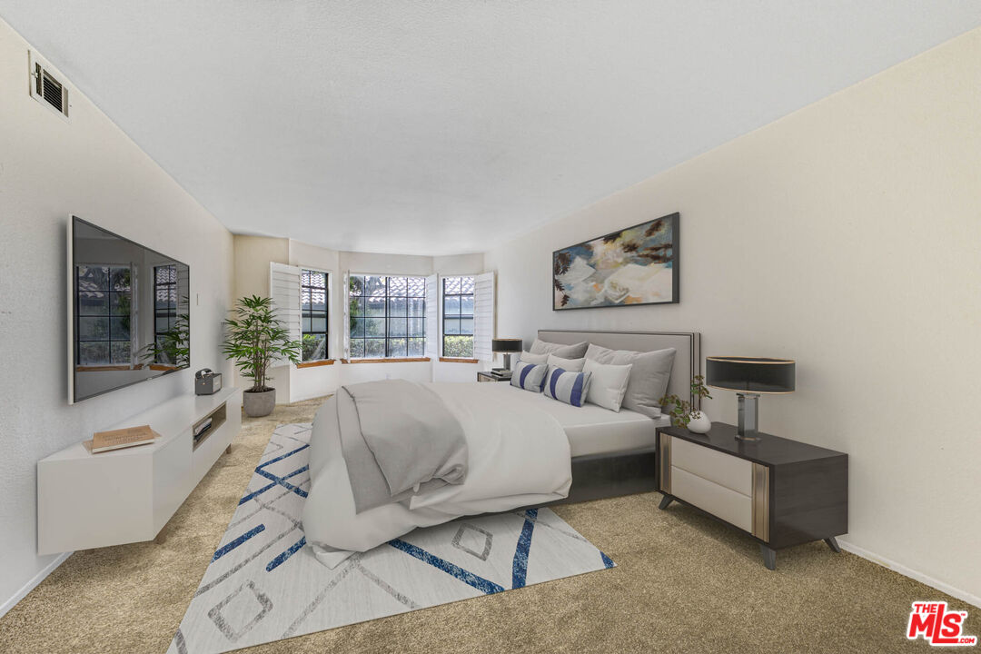 2053 Majorca Drive Oxnard, CA 93035 - Photo 9 of 15 a bed room with a bed and a couch