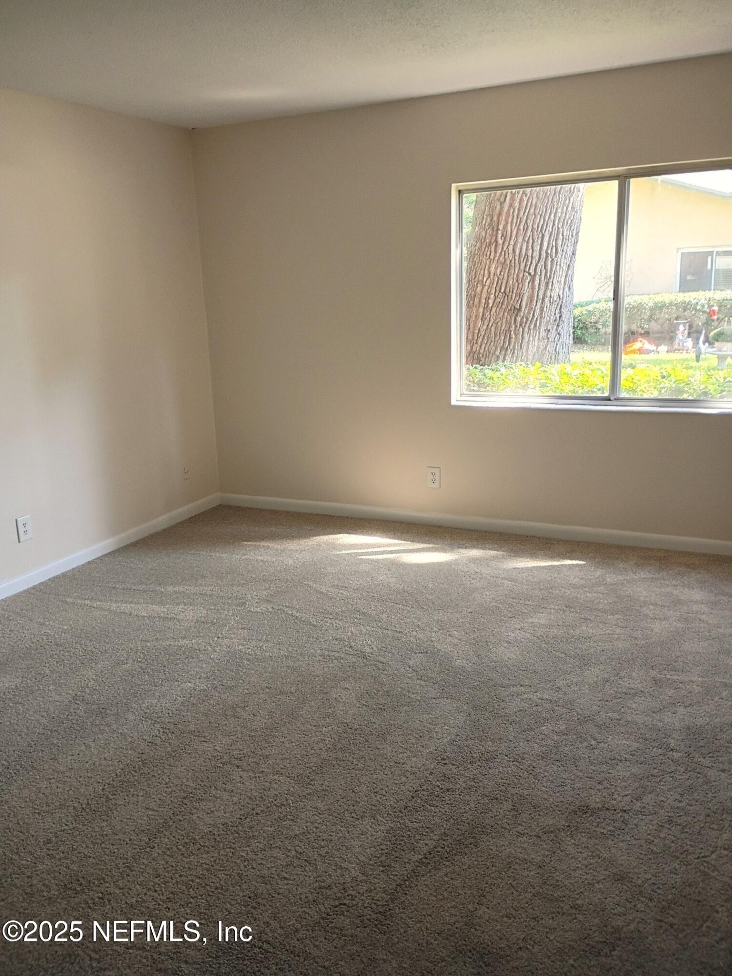 1265 The Grove Road Orange Park, FL 32073 - Photo 4 of 13 a view of an empty room with a window
