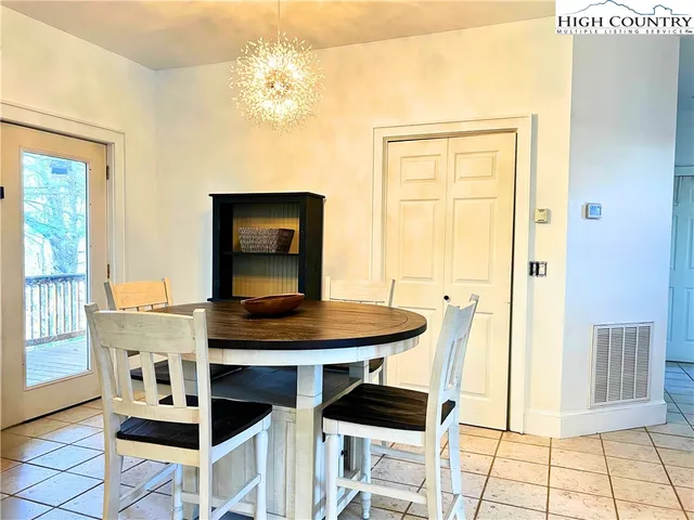 a bedroom with a bed and a television